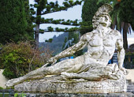 Statue of Achilles dying, shot in the foot with an arrow. Located in the gardens of the Achillion Palace, Corfu, Greece.